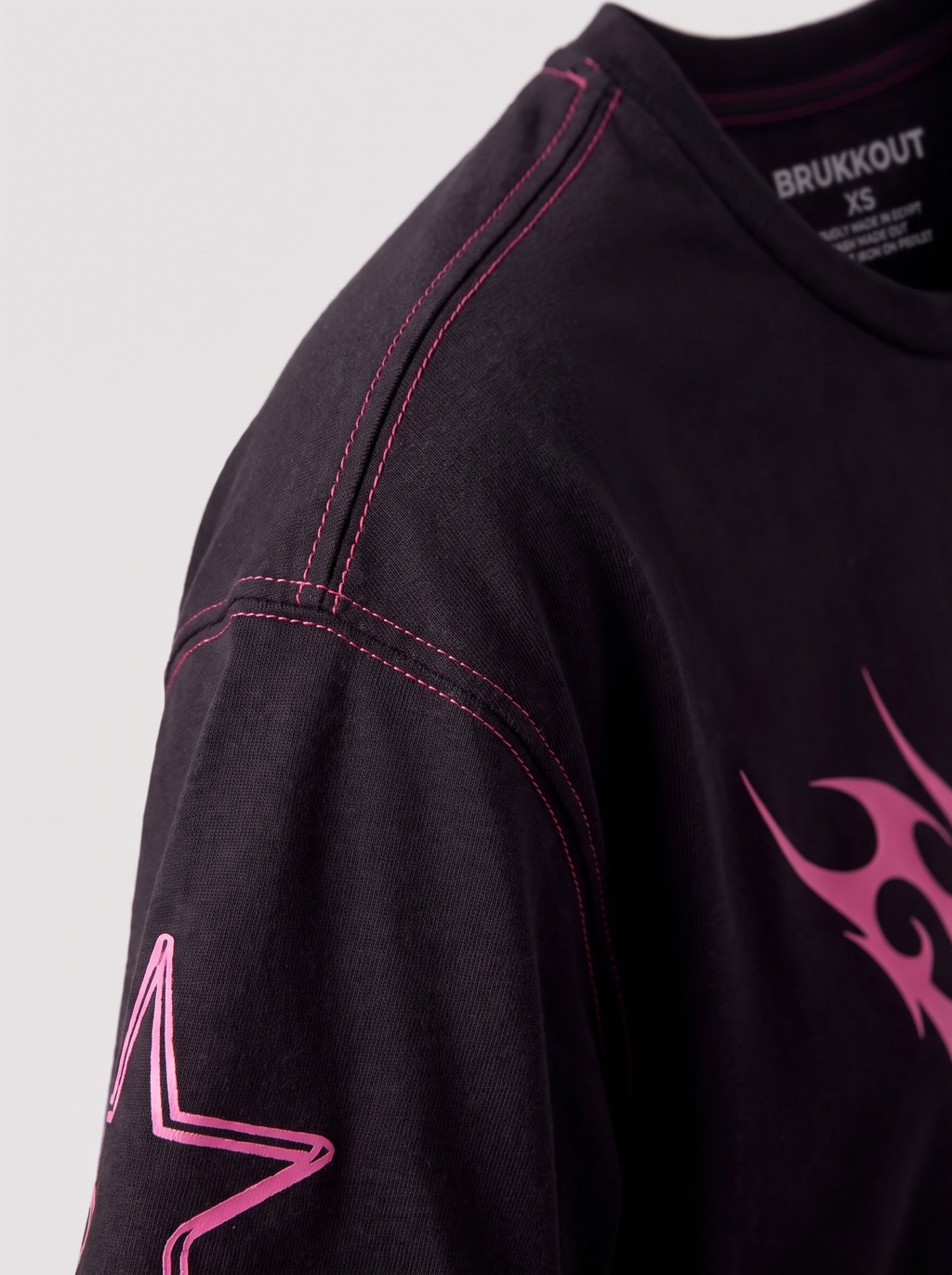 Pink stitched black tee